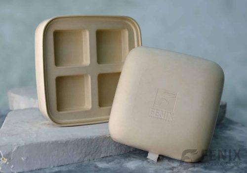 Custom molded pulp packaging box with four inner cavities and embossed Fenix Industries logo